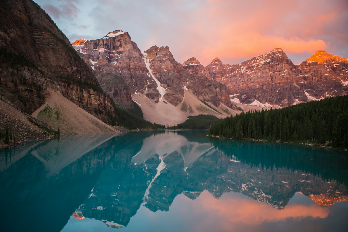 A wide mountain landscape with a clear lake and open space